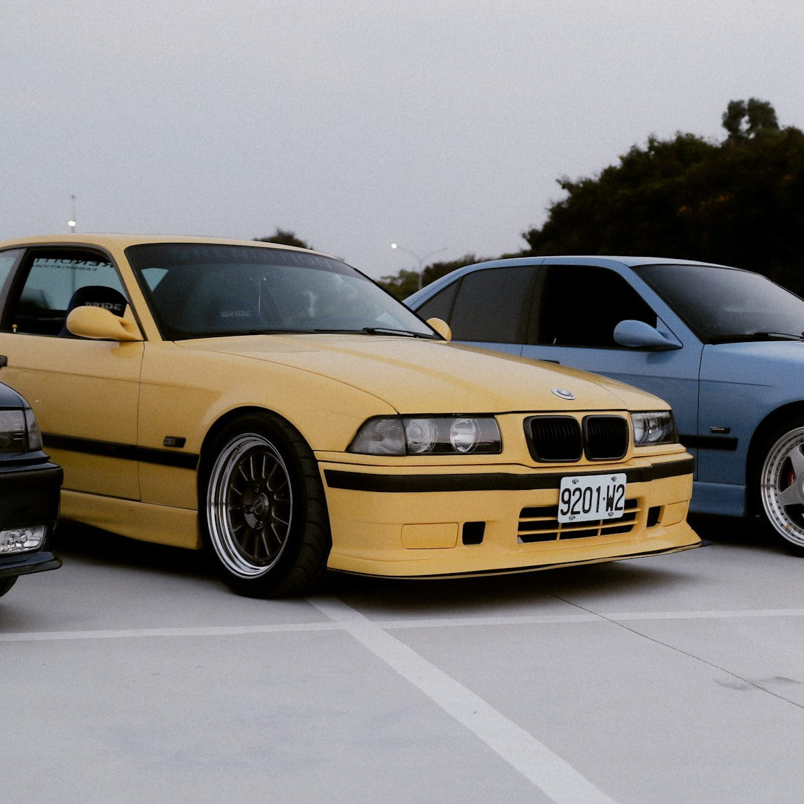 BMW E36 3-Series with Rendition OEM+ upgrades including trim, cup holders, and phone mounts