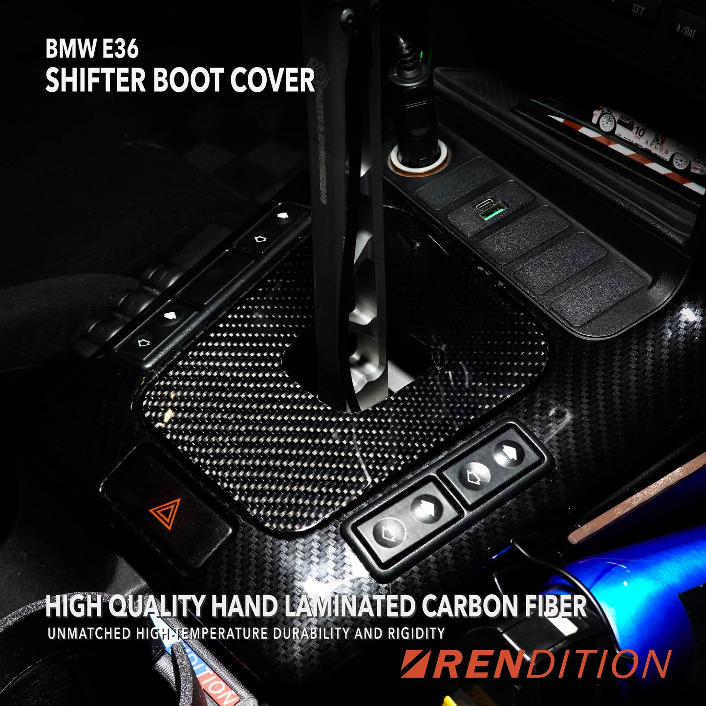 A black BMW E36 shift boot cover with a carbon fiber finish, installed in a vehicle's interior.