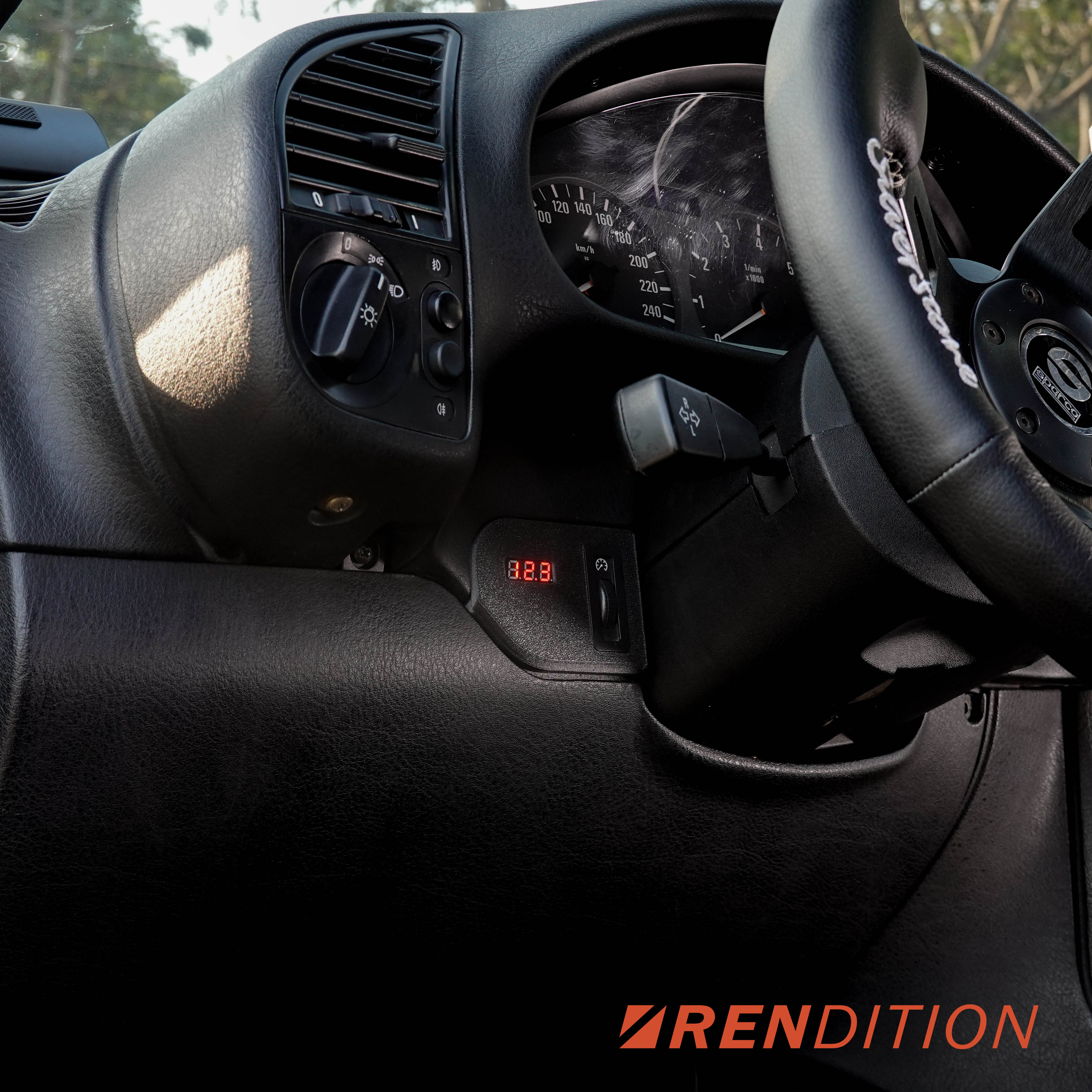 Upgrade your BMW E36 with Rendition’s Instrument Cluster Dimmer Cover Volt Meter. Direct OEM replacement with integrated volt meter and carbon fiber construction.