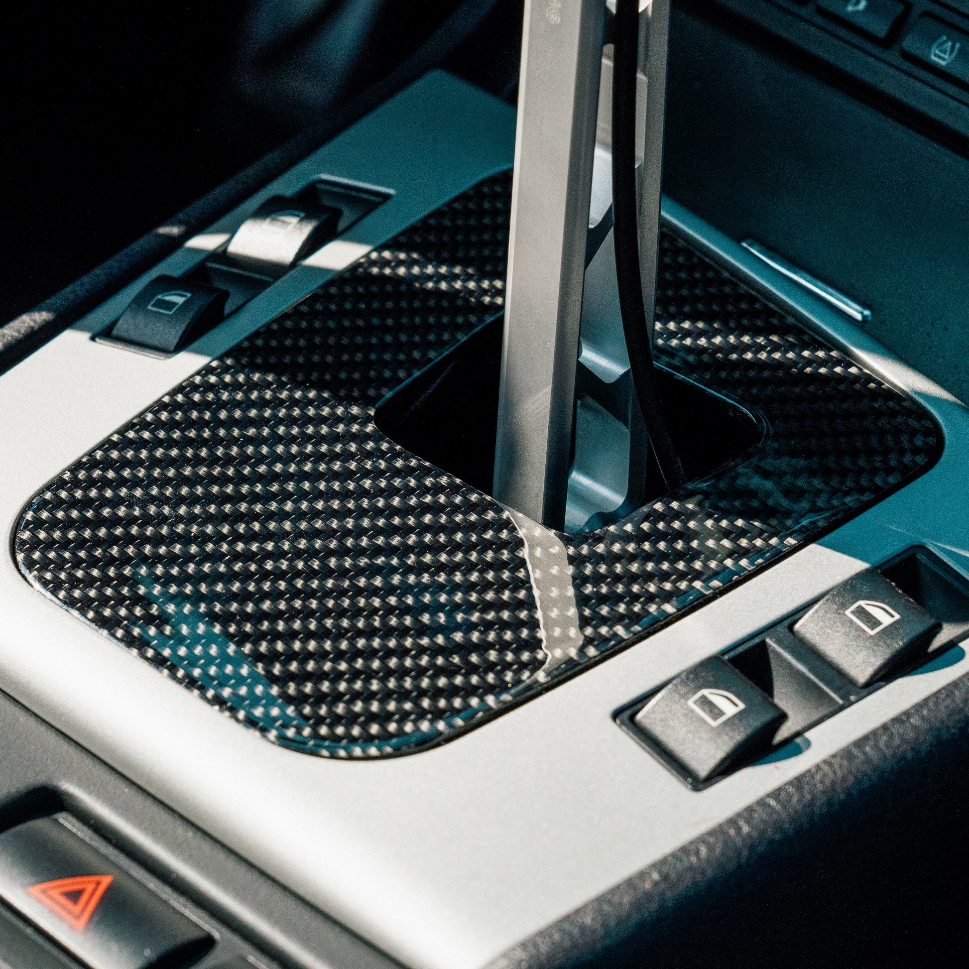 BMW E46 carbon fiber shift boot panel close-up