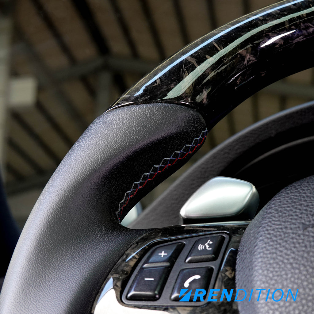 Custom BMW steering wheel in 2x2 weaved carbon, Nappa, and gloss finish