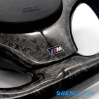 Custom BMW steering wheel in forged carbon, Alcantara, and gloss finish