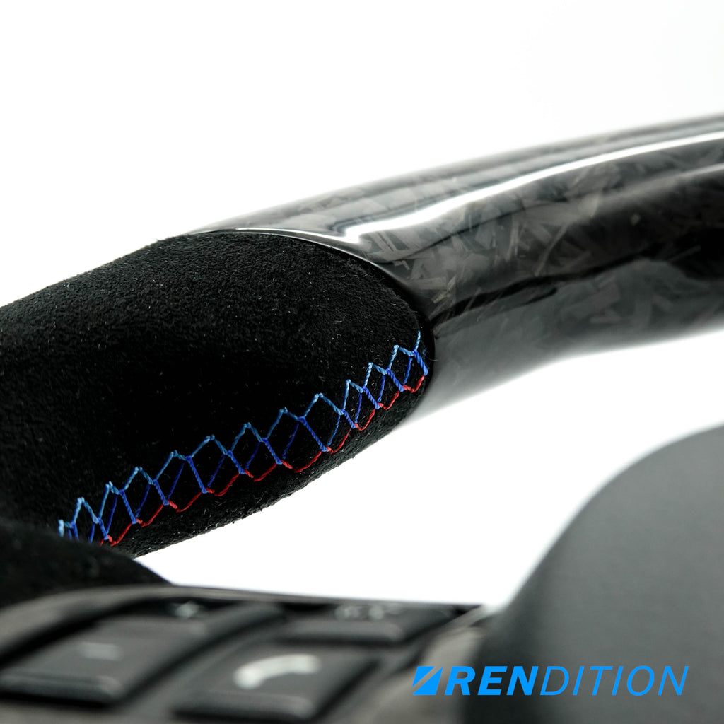 Custom BMW steering wheel in forged carbon, Alcantara, and gloss finish