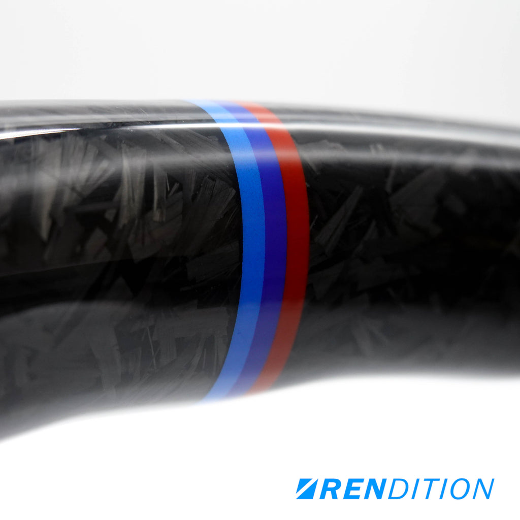 Custom BMW steering wheel in forged carbon, Alcantara, and gloss finish