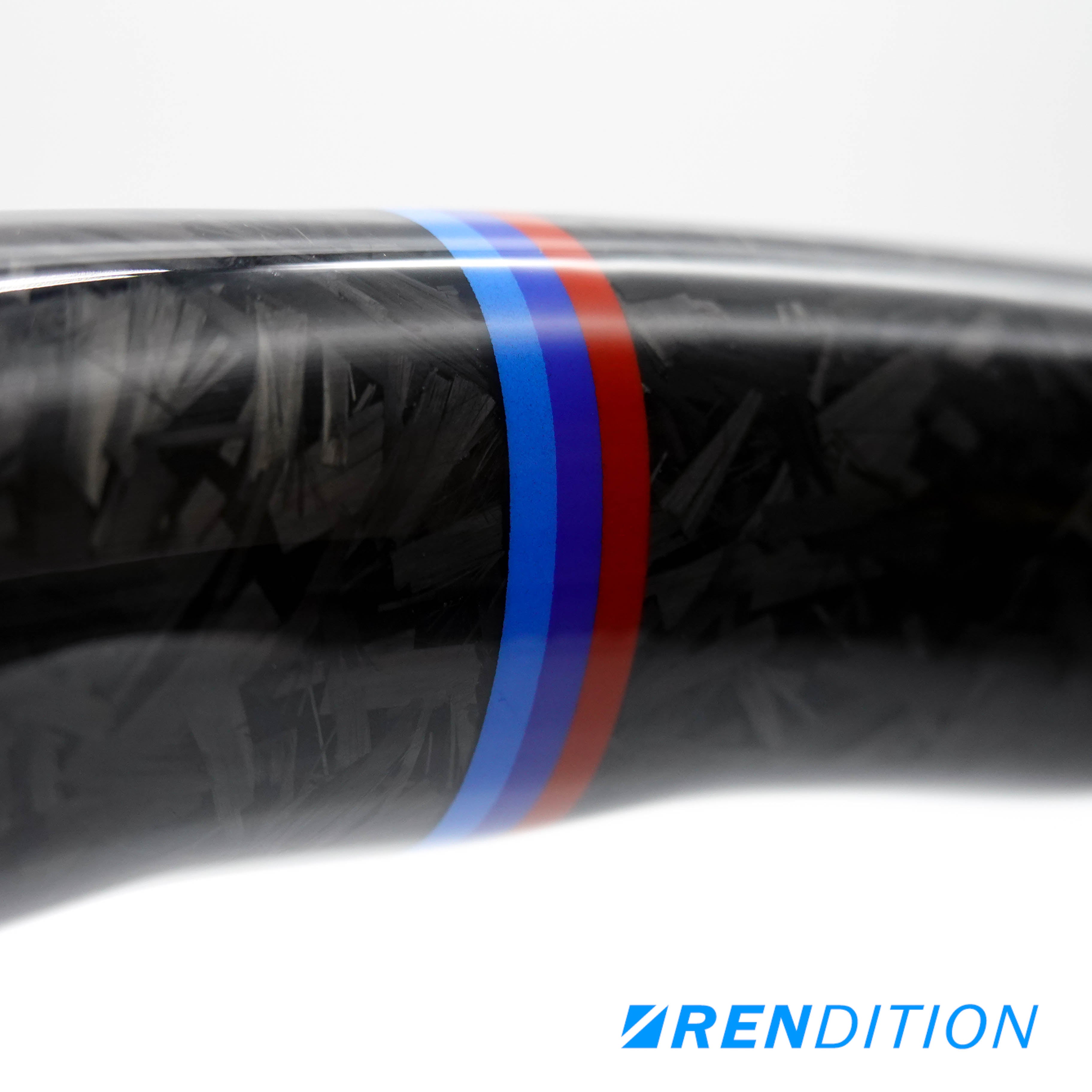 Custom BMW steering wheel in forged carbon, Alcantara, and gloss finish