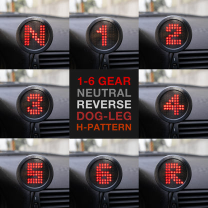 Digital display showing gear positions on a car dashboard.